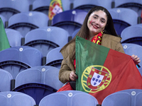 A Portugal fan waits for the start of the UEFA Nations League 2024/25 League A Group A1 match between Portugal and Poland at Estadio Do Drag...