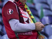 A Portugal fan waits for the start of the UEFA Nations League 2024/25 League A Group A1 match between Portugal and Poland at Estadio Do Drag...