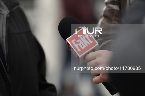 A microphone with the logo of the Polish newspaper Fakt is present during the monthly celebrations of the Smolensk disaster at the Monument...