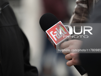 A microphone with the logo of the Polish newspaper Fakt is present during the monthly celebrations of the Smolensk disaster at the Monument...