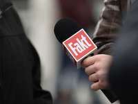 A microphone with the logo of the Polish newspaper Fakt is present during the monthly celebrations of the Smolensk disaster at the Monument...