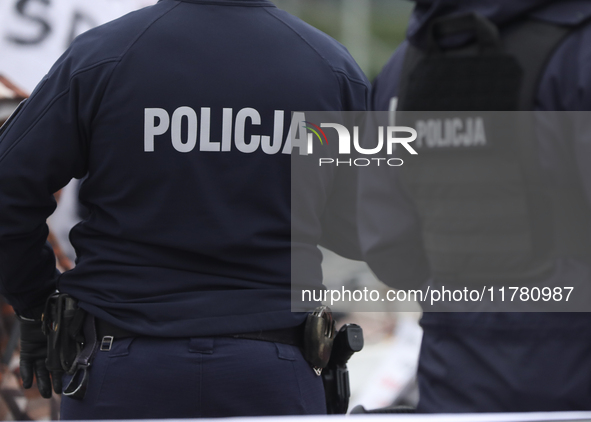 In Warsaw, Poland, on November 10, 2024, police attend the monthly celebrations of the Smolensk disaster at the Monument to the Victims of t...