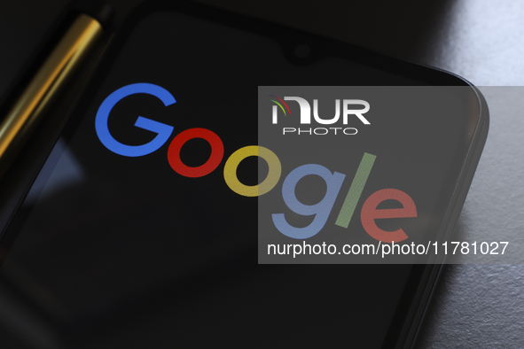 The Google logo displays on a smartphone screen in Reno, United States, on November 15, 2024. 