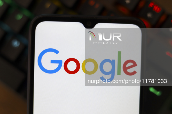 The Google logo displays on a smartphone screen in Reno, United States, on November 15, 2024. 