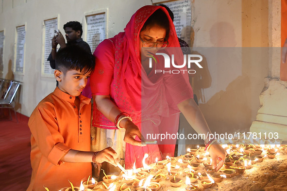 People light earthen lamps at the Shrine Galtaji temple holy pond 'kund' as part of the Deep Mahotsav celebration on the eve of Dev Deepawal...