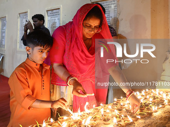 People light earthen lamps at the Shrine Galtaji temple holy pond 'kund' as part of the Deep Mahotsav celebration on the eve of Dev Deepawal...