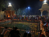 People light earthen lamps at the Shrine Galtaji temple holy pond 'kund' as part of the Deep Mahotsav celebration on the eve of Dev Deepawal...