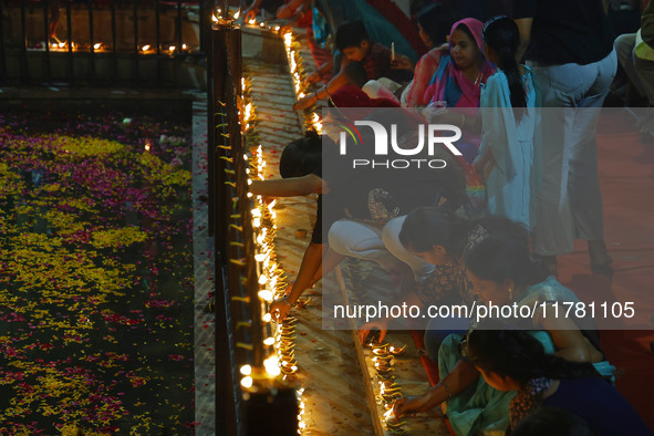 People light earthen lamps at the Shrine Galtaji temple holy pond 'kund' as part of the Deep Mahotsav celebration on the eve of Dev Deepawal...