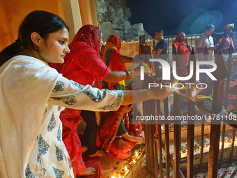 People light earthen lamps at the Shrine Galtaji temple holy pond 'kund' as part of the Deep Mahotsav celebration on the eve of Dev Deepawal...