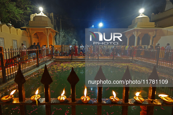 People light earthen lamps at the Shrine Galtaji temple holy pond 'kund' as part of the Deep Mahotsav celebration on the eve of Dev Deepawal...