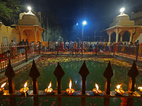 People light earthen lamps at the Shrine Galtaji temple holy pond 'kund' as part of the Deep Mahotsav celebration on the eve of Dev Deepawal...