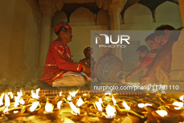 People light earthen lamps at the Shrine Galtaji temple holy pond 'kund' as part of the Deep Mahotsav celebration on the eve of Dev Deepawal...