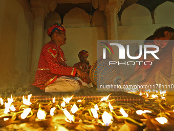 People light earthen lamps at the Shrine Galtaji temple holy pond 'kund' as part of the Deep Mahotsav celebration on the eve of Dev Deepawal...