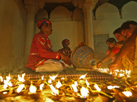 People light earthen lamps at the Shrine Galtaji temple holy pond 'kund' as part of the Deep Mahotsav celebration on the eve of Dev Deepawal...