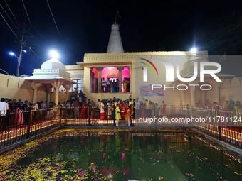 People light earthen lamps at the Shrine Galtaji temple holy pond 'kund' as part of the Deep Mahotsav celebration on the eve of Dev Deepawal...