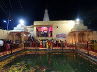 People light earthen lamps at the Shrine Galtaji temple holy pond 'kund' as part of the Deep Mahotsav celebration on the eve of Dev Deepawal...