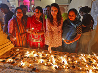 JMC Heritage Mayor Kusum Yadav and people light earthen lamps at the Shrine Galtaji temple holy pond 'kund' as part of the Deep Mahotsav cel...