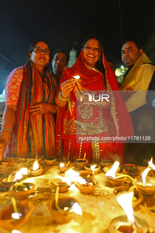 JMC Heritage Mayor Kusum Yadav lights earthen lamps at the Shrine Galtaji temple holy pond 'kund' as part of the Deep Mahotsav celebration o...