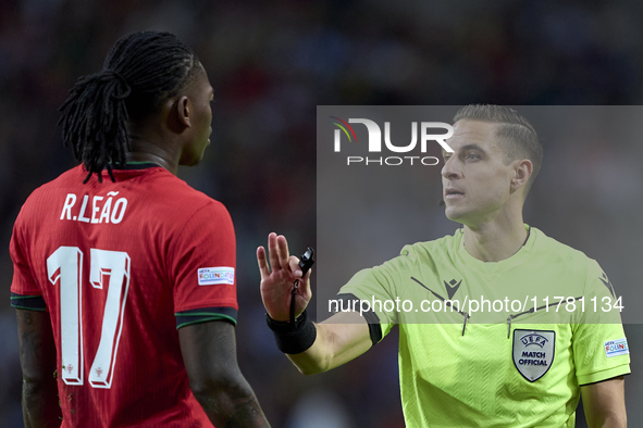 Referee Donatas Rumsas and Rafael Leao of Portugal discuss during the UEFA Nations League 2024/25 League A Group A1 match between Portugal a...