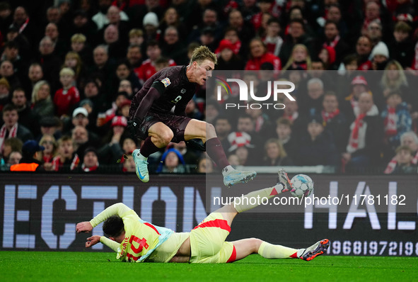 Rasmus Hoejlund of Denmark and Aymeric Laporte of Spain battle for the ball during the Nations League Round 5 match between Denmark against...