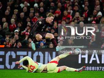 Rasmus Hoejlund of Denmark and Aymeric Laporte of Spain battle for the ball during the Nations League Round 5 match between Denmark against...