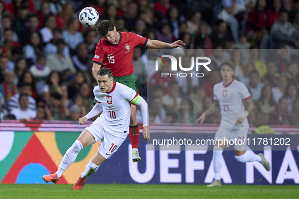 Joao Neves of Portugal competes for the ball with Piotr Zielinski of Poland during the UEFA Nations League 2024/25 League A Group A1 match b...