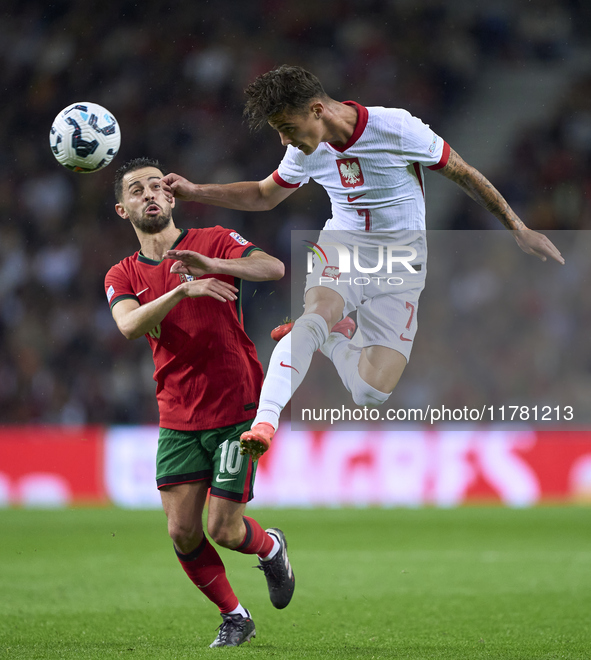 Bernardo Silva of Portugal competes for the ball with Kacper Urbanski of Poland during the UEFA Nations League 2024/25 League A Group A1 mat...