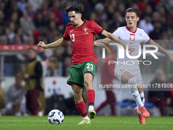 Kacper Urbanski of Poland competes for the ball with Vitor Ferreira 'Vitinha' of Portugal during the UEFA Nations League 2024/25 League A Gr...