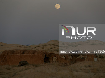 A photo taken in Oued Souf, Algeria, on November 15, 2024, shows a full moon during the 6th International Saharan Tourism Festival (FITS). O...