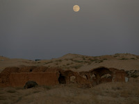 A photo taken in Oued Souf, Algeria, on November 15, 2024, shows a full moon during the 6th International Saharan Tourism Festival (FITS). O...