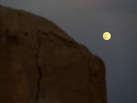 A photo taken in Oued Souf, Algeria, on November 15, 2024, shows a full moon during the 6th International Saharan Tourism Festival (FITS). O...