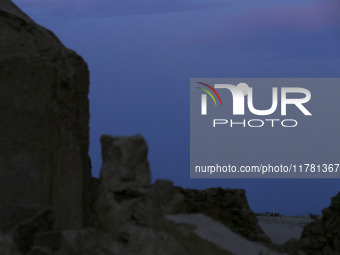 A photo taken in Oued Souf, Algeria, on November 15, 2024, shows a full moon during the 6th International Saharan Tourism Festival (FITS). O...