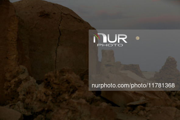 A photo taken in Oued Souf, Algeria, on November 15, 2024, shows a full moon during the 6th International Saharan Tourism Festival (FITS). O...