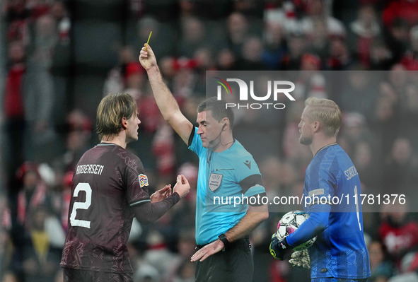 Joachim Andersen of Denmark  receives a yellow card during the Nations League Round 5 match between Denmark against Spain at Parken, Copenha...