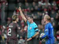 Joachim Andersen of Denmark  receives a yellow card during the Nations League Round 5 match between Denmark against Spain at Parken, Copenha...