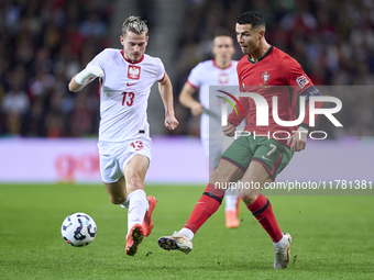 Cristiano Ronaldo of Portugal is challenged by Jakub Kaminski of Poland during the UEFA Nations League 2024/25 League A Group A1 match betwe...