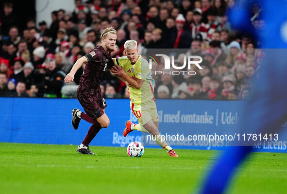 Morten Hjulmand of Denmark and Dani Olmo of Spain battle for the ball during the Nations League Round 5 match between Denmark against Spain...