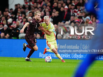 Morten Hjulmand of Denmark and Dani Olmo of Spain battle for the ball during the Nations League Round 5 match between Denmark against Spain...