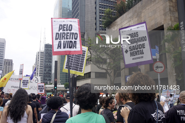 Labor activists demonstrate on Paulista Avenue in Sao Paulo, Brazil, on November 15, 2024 against the work schedule where workers have only...