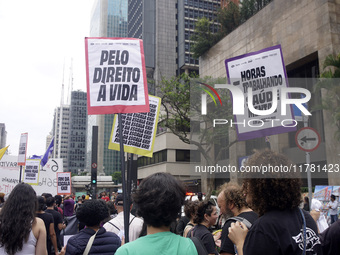 Labor activists demonstrate on Paulista Avenue in Sao Paulo, Brazil, on November 15, 2024 against the work schedule where workers have only...