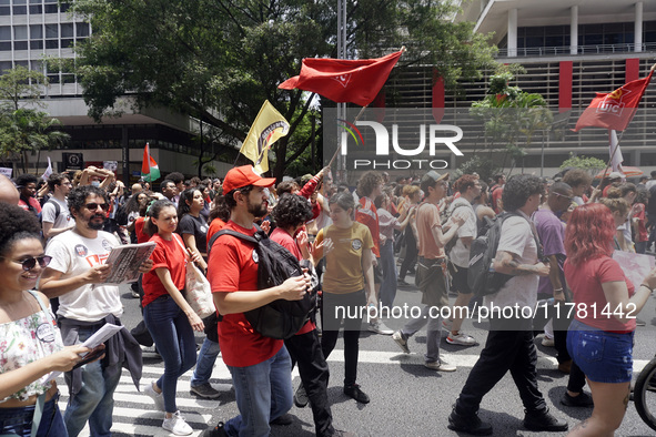 Labor activists demonstrate on Paulista Avenue in Sao Paulo, Brazil, on November 15, 2024 against the work schedule where workers have only...