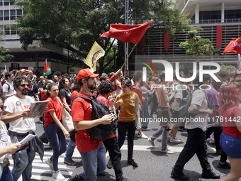 Labor activists demonstrate on Paulista Avenue in Sao Paulo, Brazil, on November 15, 2024 against the work schedule where workers have only...