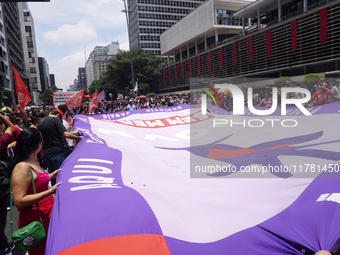 Labor activists demonstrate on Paulista Avenue in Sao Paulo, Brazil, on November 15, 2024 against the work schedule where workers have only...