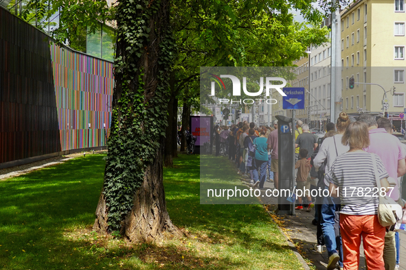 Visitors line up for the 'Party of Life' exhibition at the Brandhorst Museum in Munich, Germany, on August 18, 2024. People queue outside th...