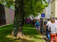 Visitors line up for the 'Party of Life' exhibition at the Brandhorst Museum in Munich, Germany, on August 18, 2024. People queue outside th...