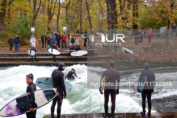 Surfers brave the icy waters of the Eisbach stream in Munich, Germany, on November 15, 2024. With temperatures at a brisk 5 degrees Celsius,...