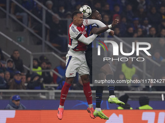 Marcus Thuram of FC Internazionale competes for the ball with Gabriel of Arsenal during the UEFA Champions League 2024/25 League Phase MD4 m...