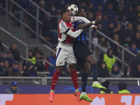 Marcus Thuram of FC Internazionale competes for the ball with Gabriel of Arsenal during the UEFA Champions League 2024/25 League Phase MD4 m...