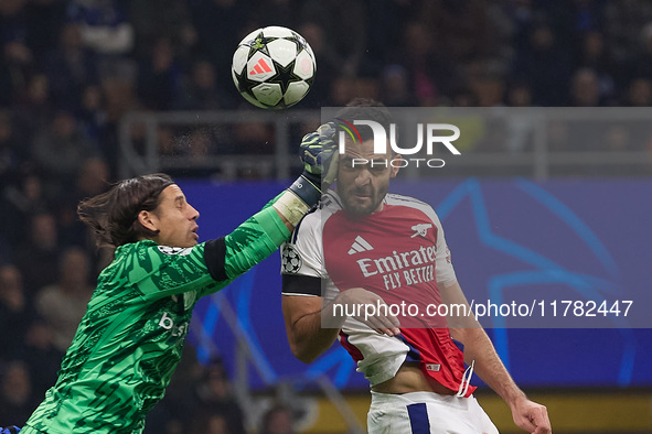 Yann Sommer of FC Internazionale competes for the ball with Mikel Merino of Arsenal during the UEFA Champions League 2024/25 League Phase MD...