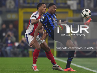 Denzel Dumfries of FC Internazionale competes for the ball with Jurrien Timber of Arsenal during the UEFA Champions League 2024/25 League Ph...